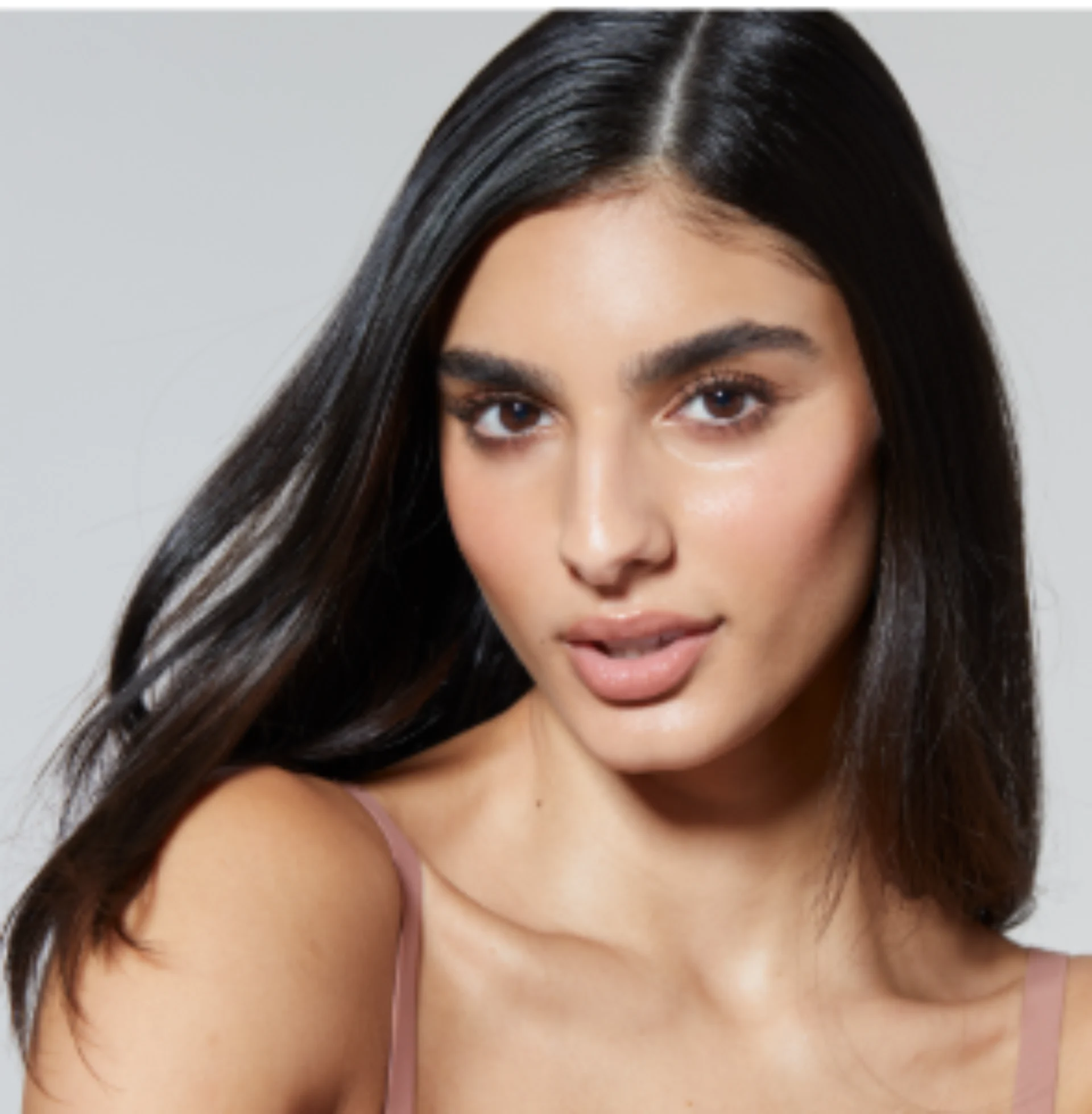 Woman with healthy, radiant skin after personalised skin health treatment at Lola Room